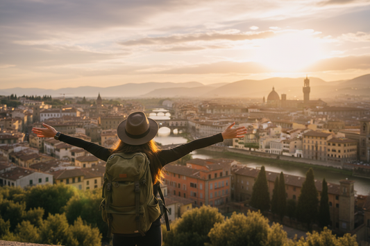 A solo traveler with a backpack standing in front of a scenic European cityscape at golden hour